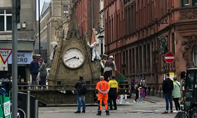 clock being removed from manchester town hall