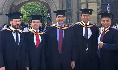 Group of male MBA graduates