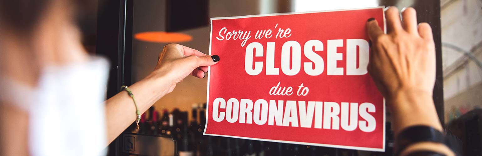 A sign in a shop saying they are closed due to coronavirus 