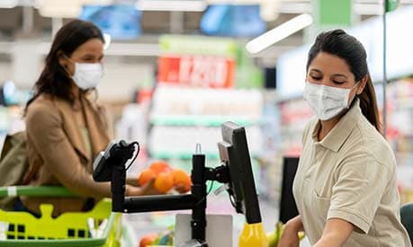 supermarket checkout woman wearing face mask