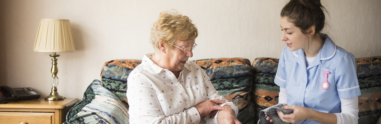 nurse in home with patient health social care